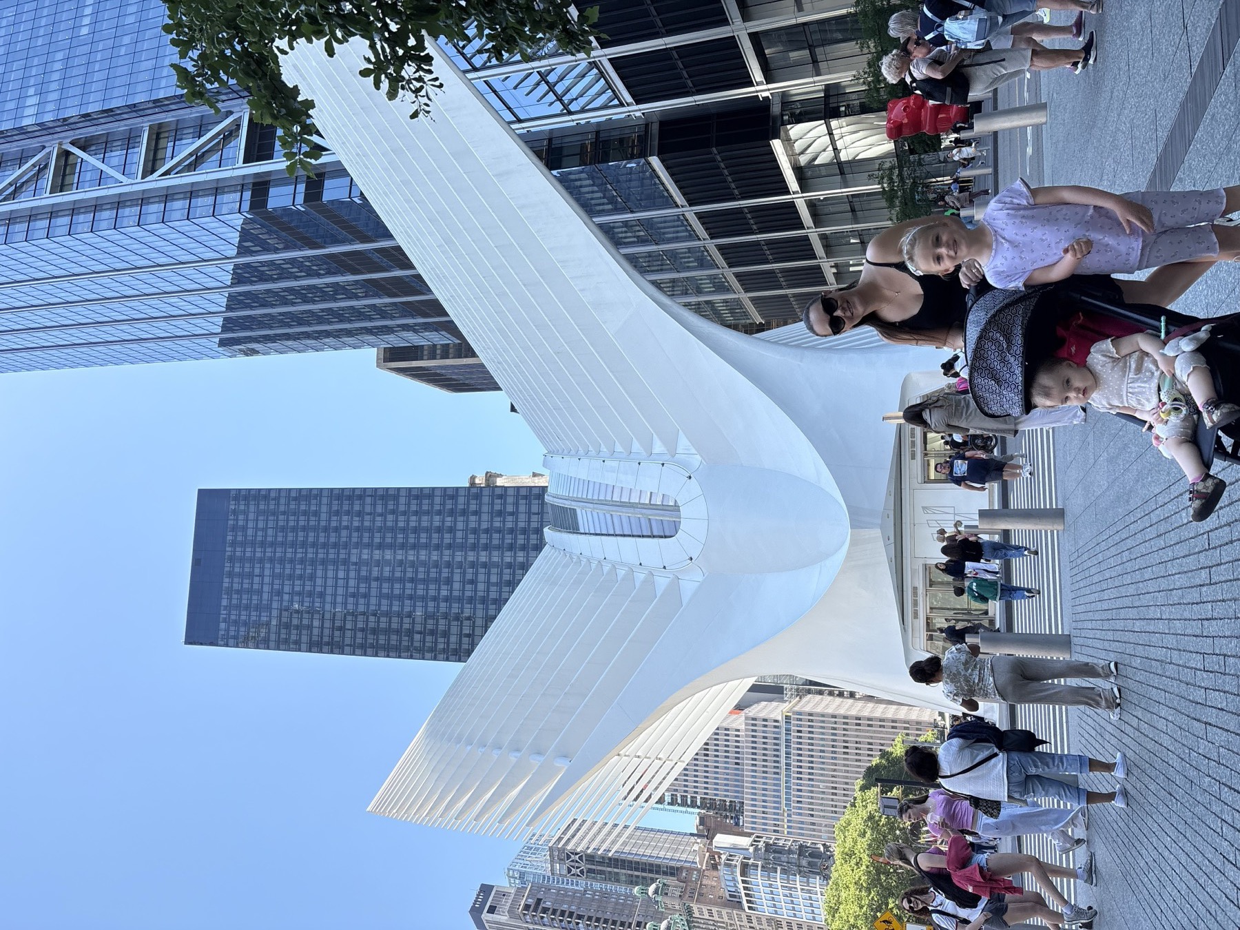 The family in front of the Oculus at the World Trade Center, one of those places that makes even a short stop feel like an event